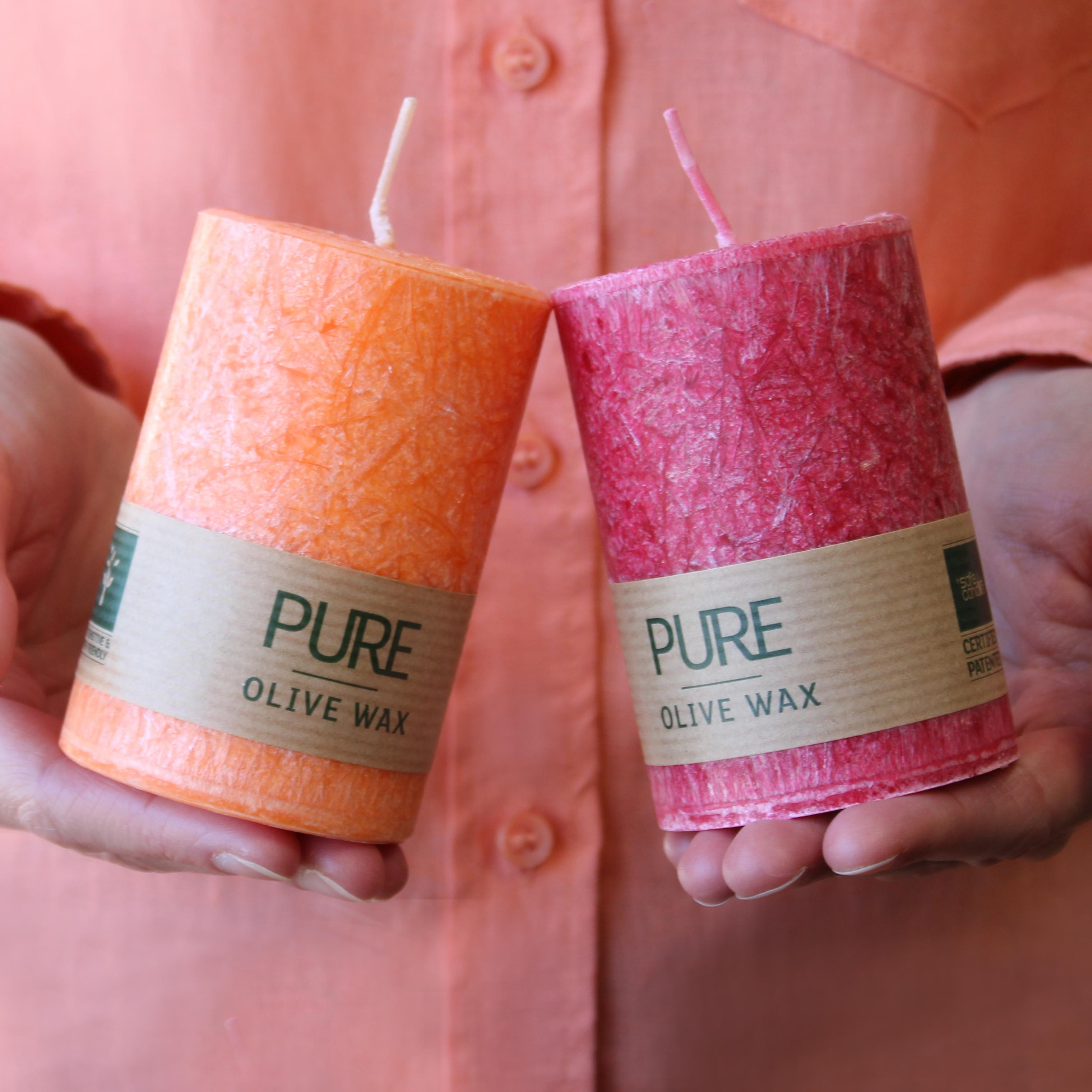 Person holding two Vegan-Friendly Pure Olive Wax Candles 90x60