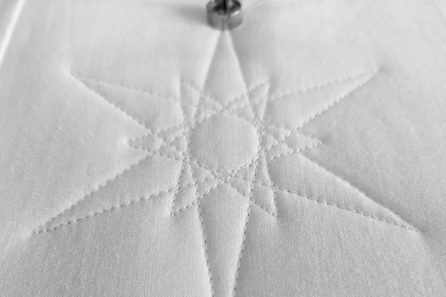 Image showing a design stitched using a longarm quilting service