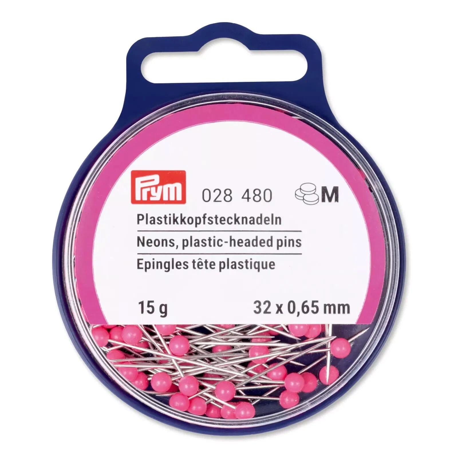 A circular plastic box containing 15g of 0.65mm x 32mm neon pink plastic headed pins with silver shaft made by Prym