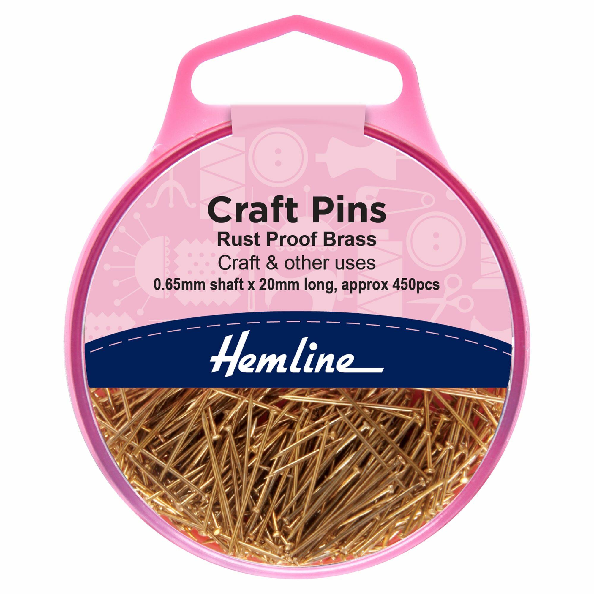 Pink Hemline storage pot containing brass pins