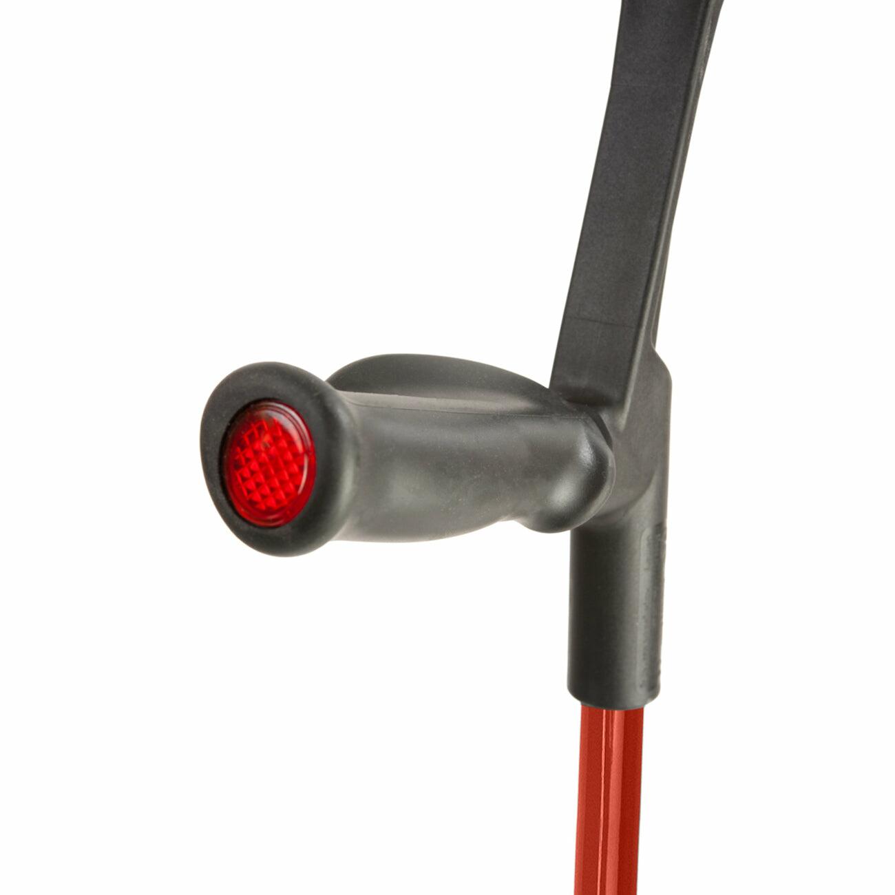 Comfort grip handle of a red Flexyfoot Comfort Grip Open Cuff Crutch