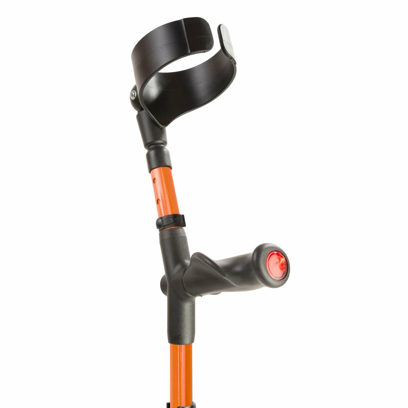 Comfort grip handle and closed cuff of an orange Flexyfoot Comfort Grip Double Adjustable Crutch