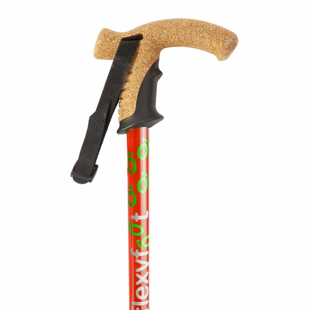 The cork handle of a red Flexyfoot Premium Cork Handle Folding Walking Stick