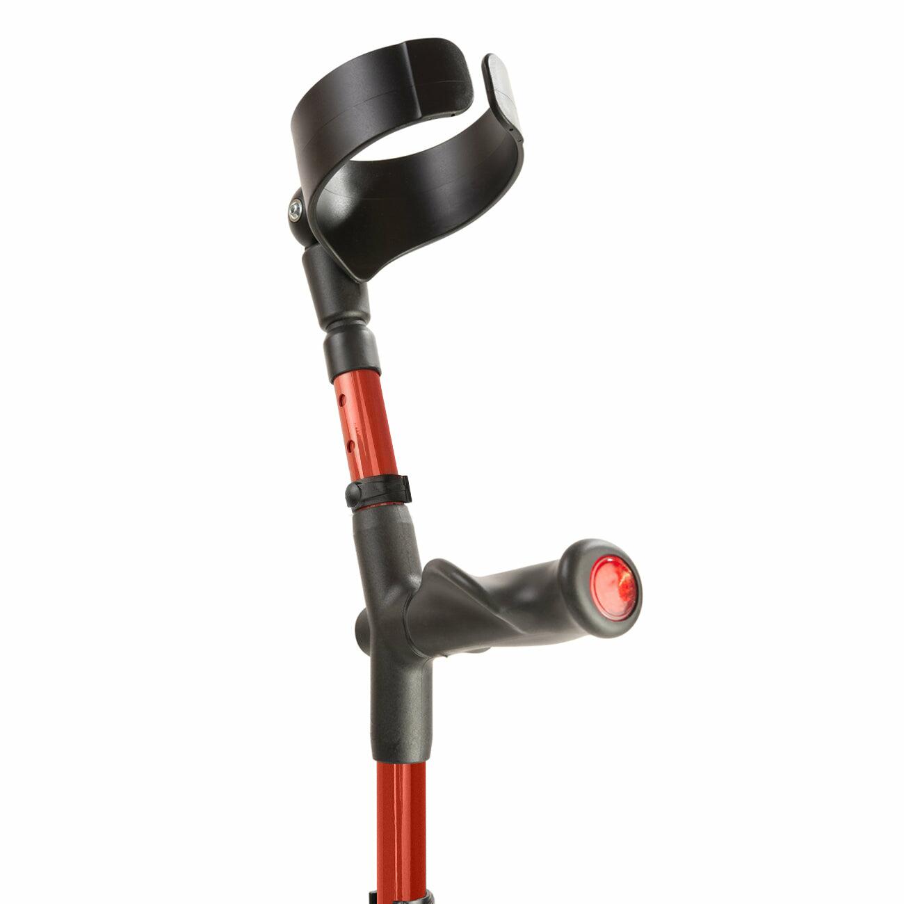 Comfort grip handle and closed cuff of a red Flexyfoot Comfort Grip Double Adjustable Crutch