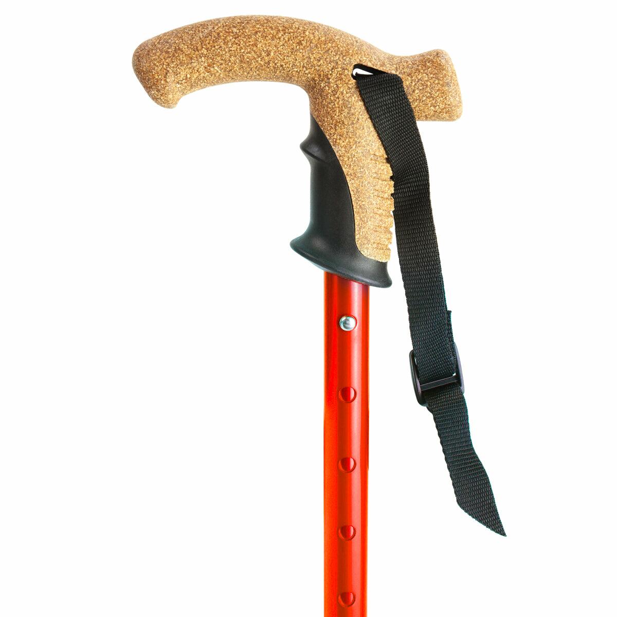The cork handle of a red Flexyfoot Premium Cork Handle Walking Stick