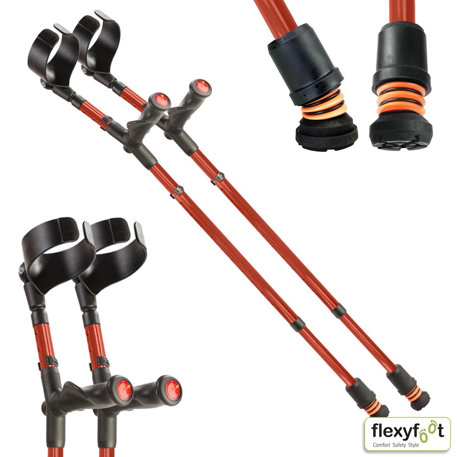 A pair of red Flexyfoot Comfort Grip Double Adjustable Crutches