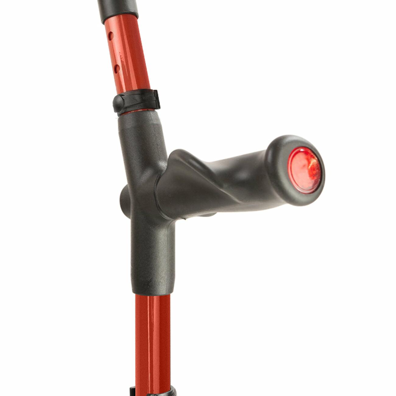 Comfort grip handle of a red Flexyfoot Comfort Grip Double Adjustable Crutch