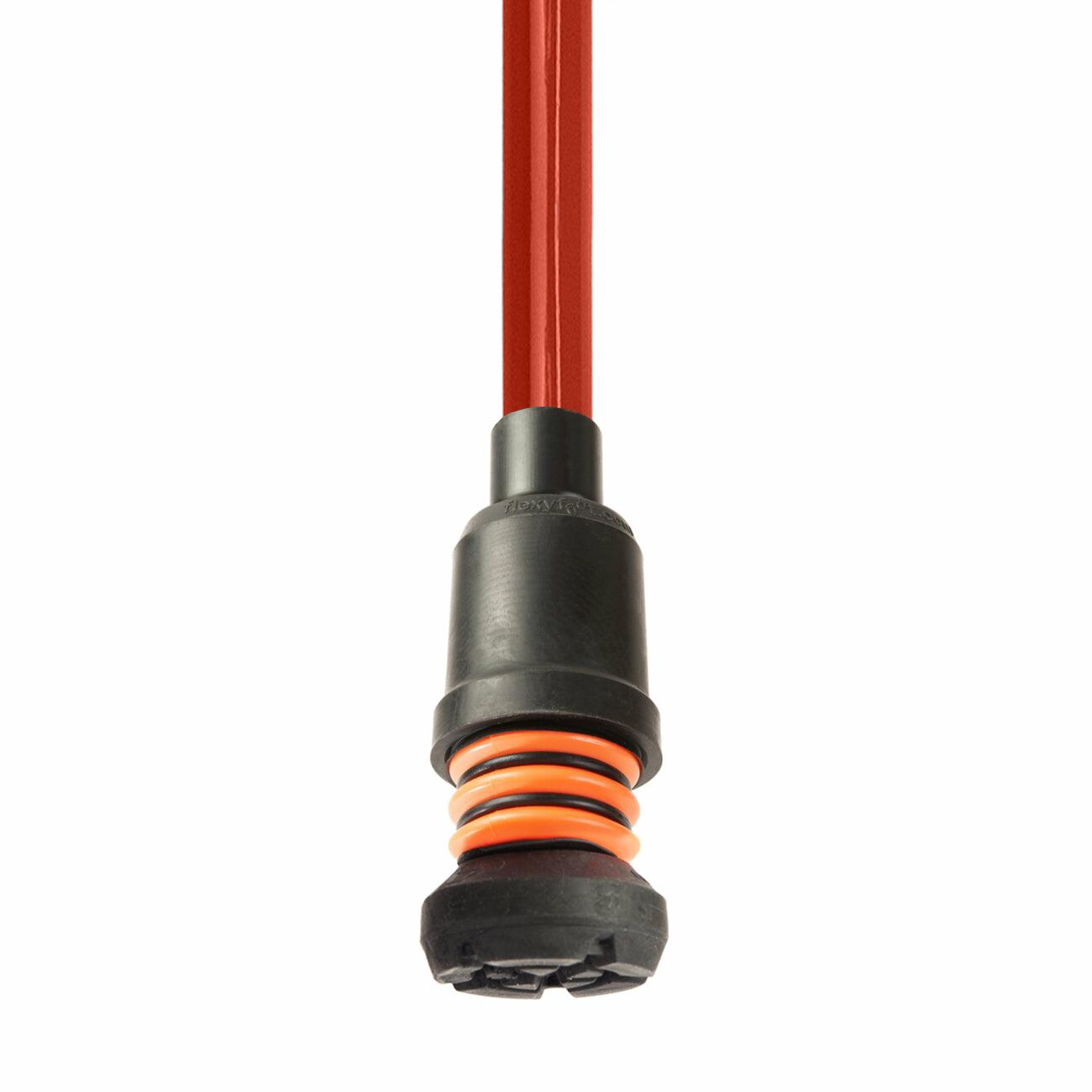 A red Flexyfoot Comfort Grip Double Adjustable Crutch tipped with a Flexyfoot ferrule