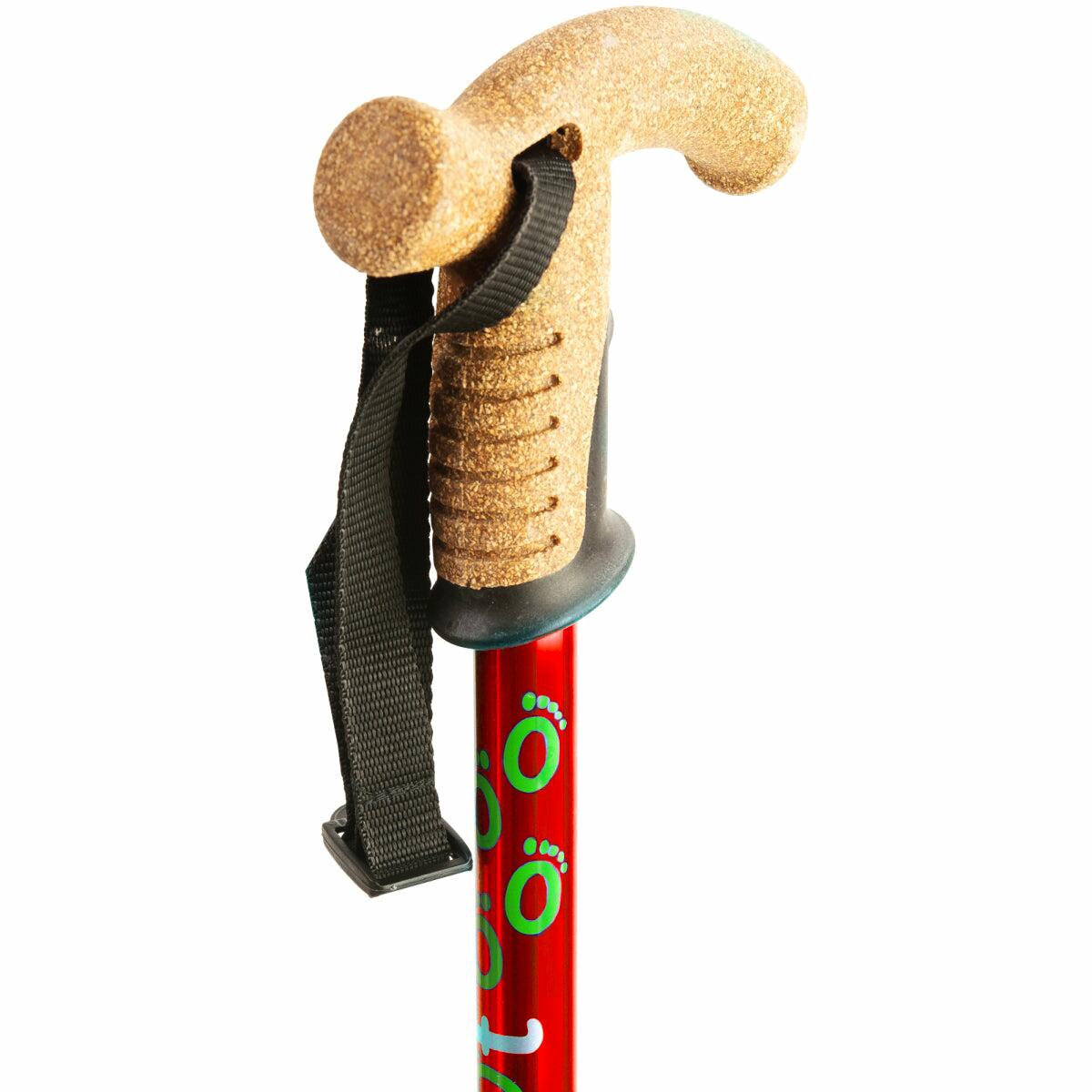 The cork handle of a red Flexyfoot Premium Cork Handle Folding Walking Stick