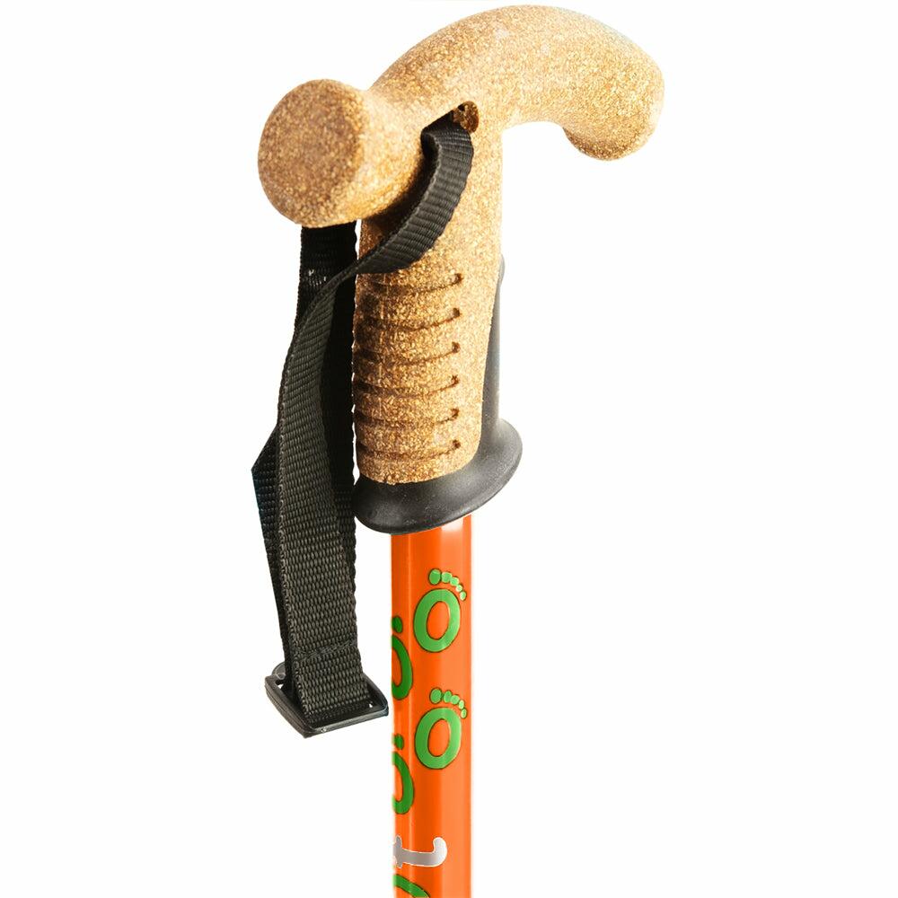 The cork handle of an orange Flexyfoot Premium Cork Handle Folding Walking Stick