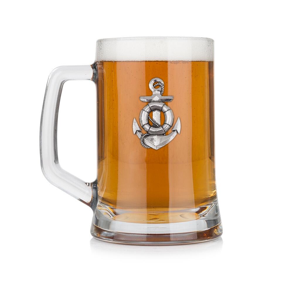 A Beer Tankard with a Pewter Anchor badge on the front, filled with Amber Beer