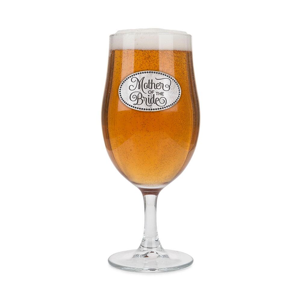 A Stemmed Pint Beer Glass with a Pewter Mother of the Bride badge on the front, filled with Beer