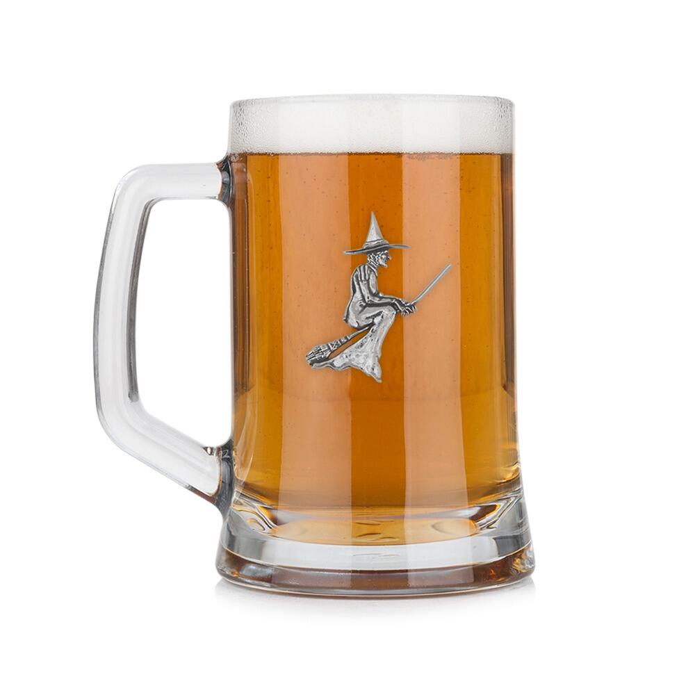 A Beer Tankard with a Pewter Witch badge on the front, filled with Amber BeerRetry
