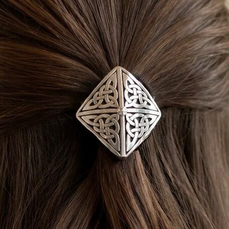 Diamond-shaped pewter Celtic hair bobble featuring four quadrants of intricate trinity knotwork meeting at a small central bead accent
