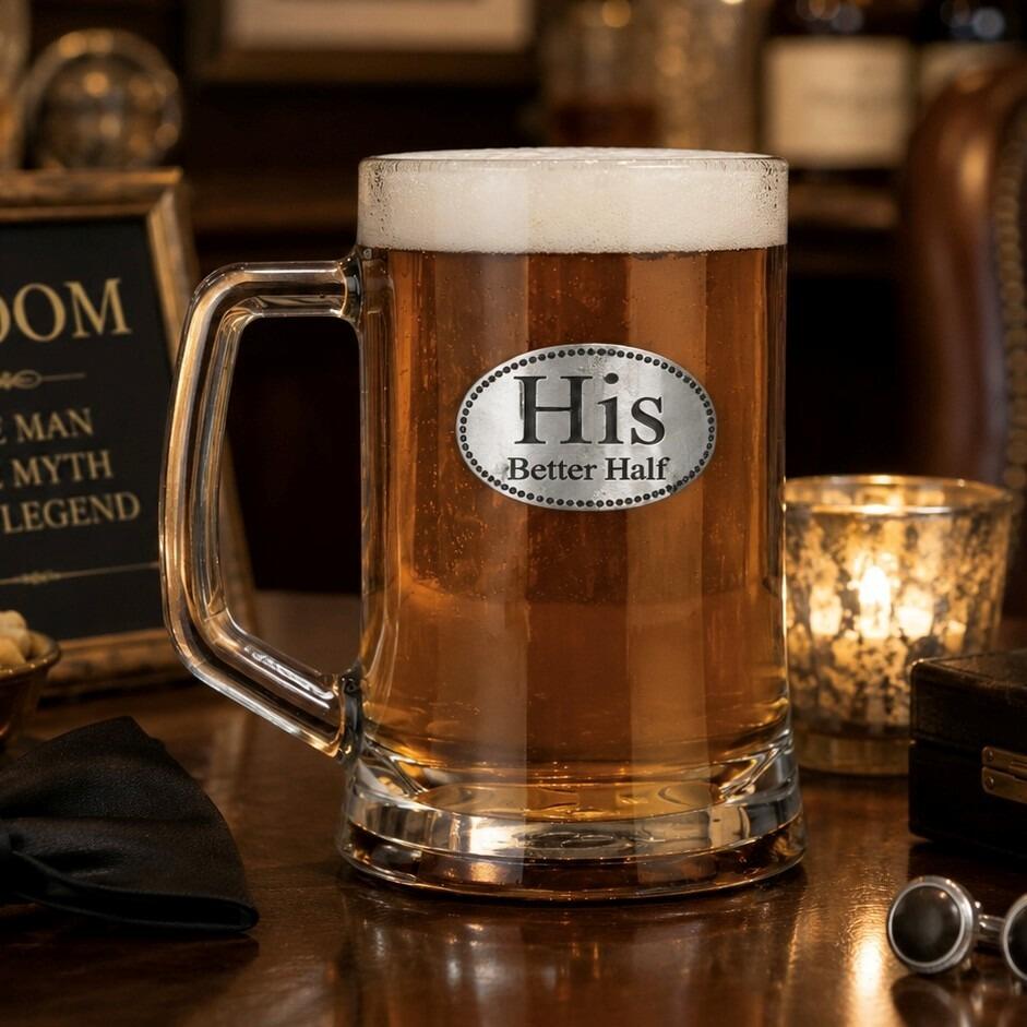 A Beer Tankard with a Pewter His badge on the front, filled with Amber Beer