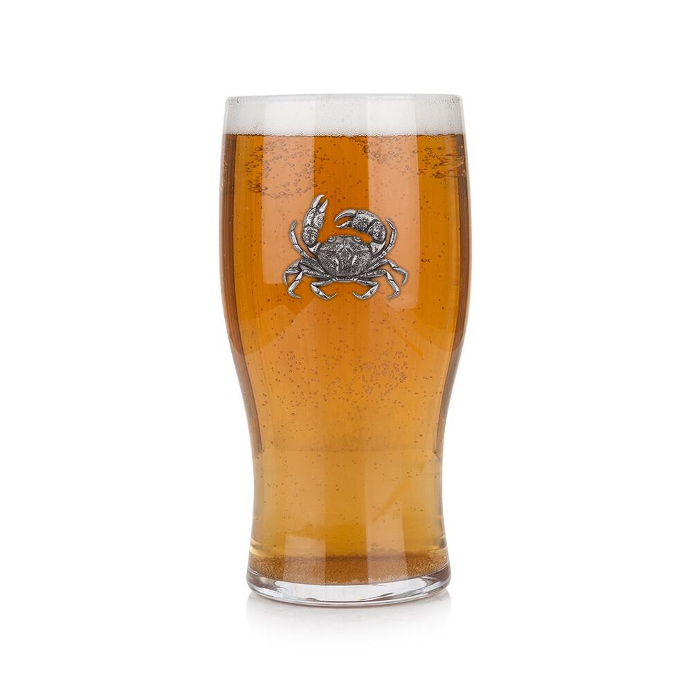 Pint glass with handmade pewter crab badge featuring detailed shell and claws filled with golden beerRetryClaude can make mistakes. Please double-check responses.