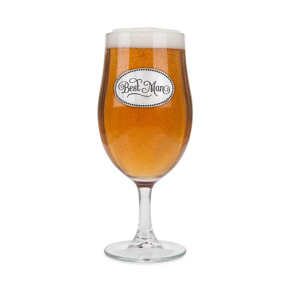 A Stemmed Pint Beer Glass with a Pewter Best Man badge on the front, filled with Beer