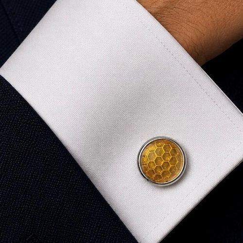 Handcrafted pewter cufflinks with a detailed honeycomb pattern embossed in transparent yellow enamel