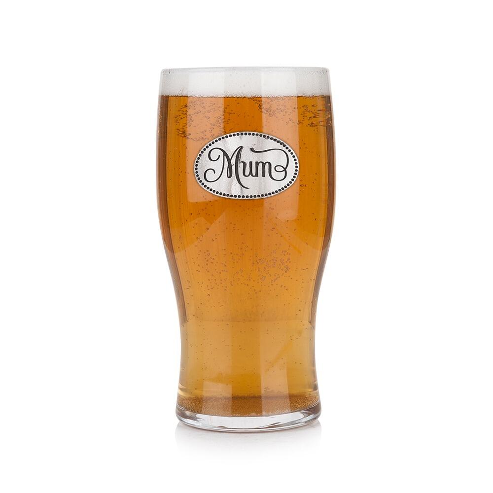 Pint glass with handmade pewter mum badge featuring elegant script lettering filled with golden beer