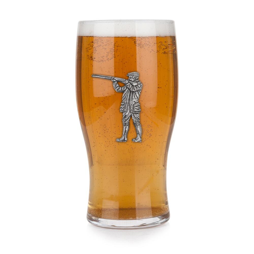 Pint glass with handmade pewter shooting scene with detailed shotgun and clay pigeon targets badge filled with golden beerRetryClaude can make mistakes. Please double-check responses.