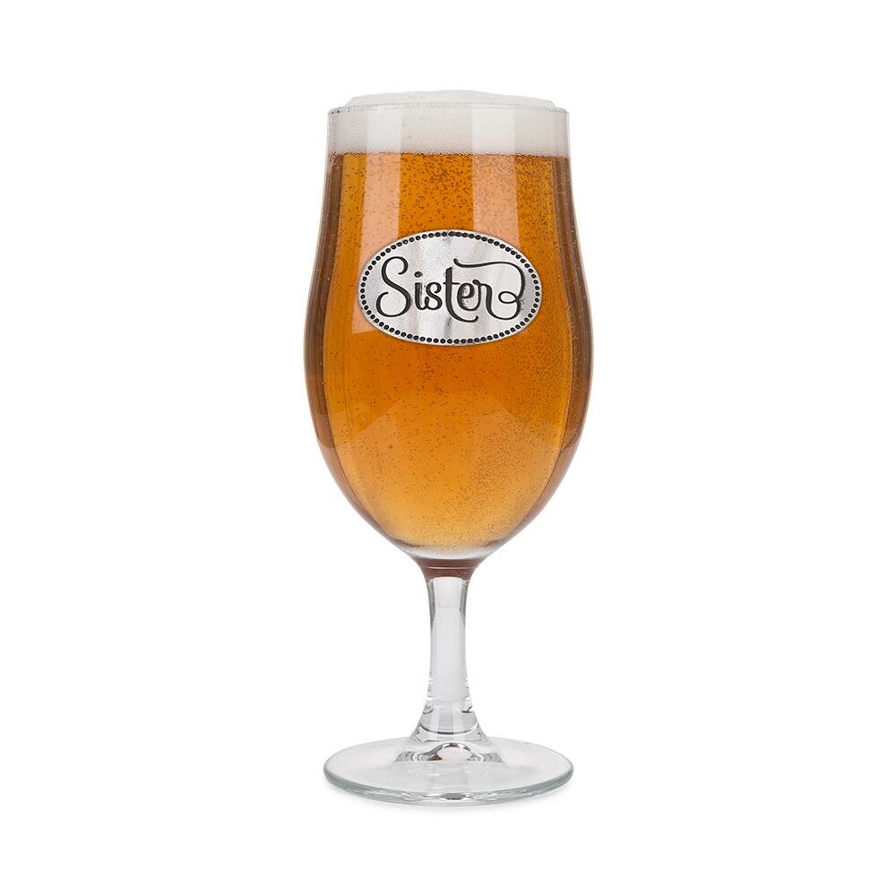 A Stemmed Pint Beer Glass with a Pewter Sister badge on the front, filled with Beer