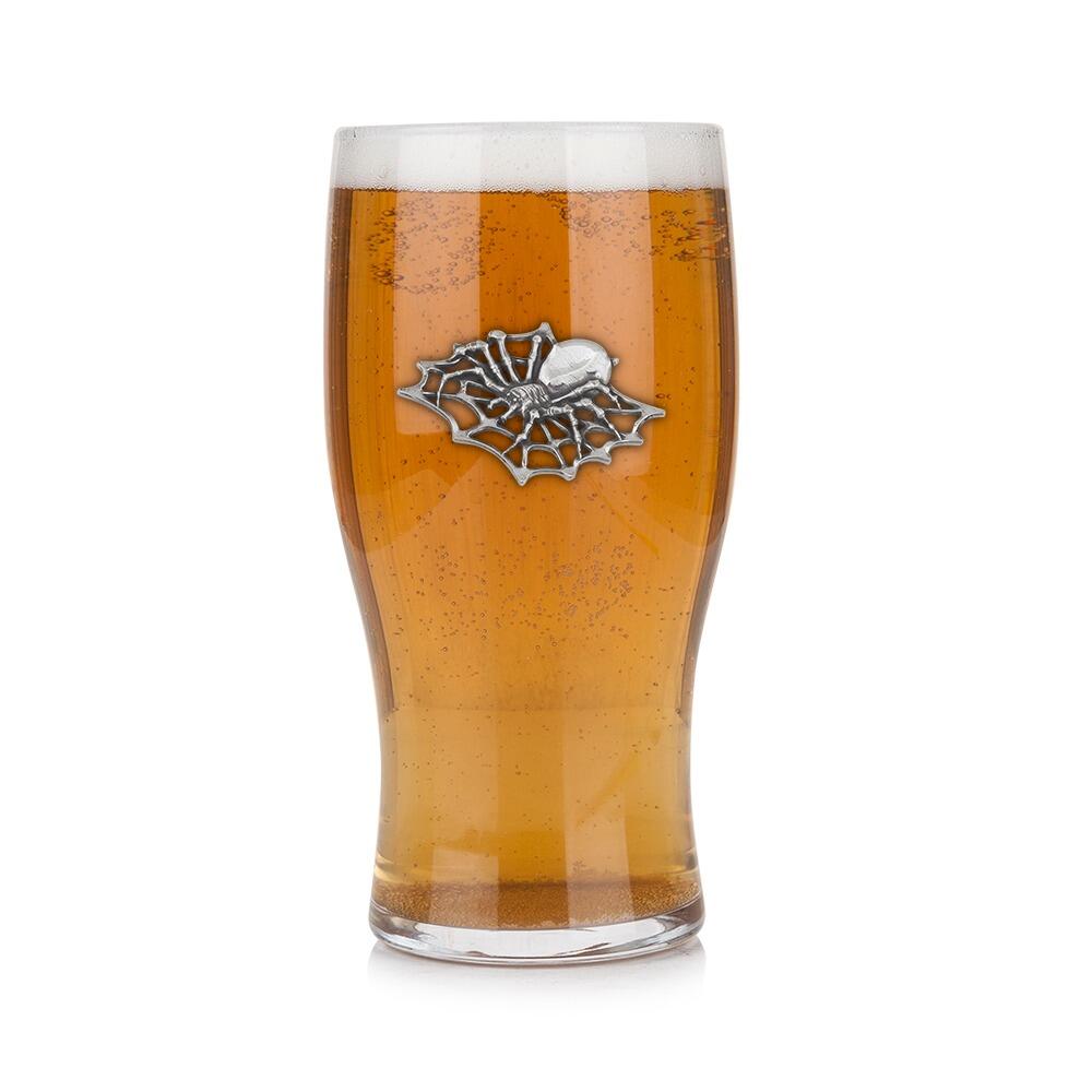 Pint glass with handmade pewter "Spider" badge, filled with golden beer