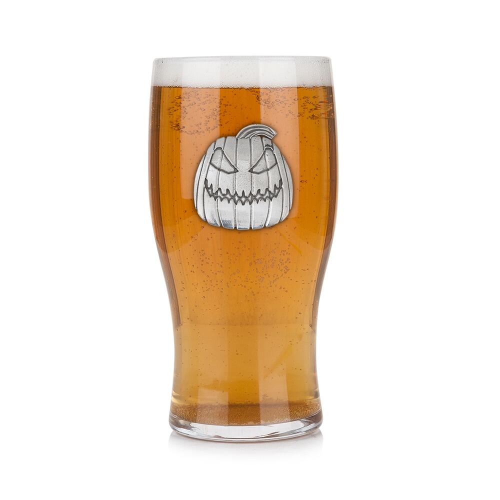 Pint glass with handmade pewter "Pumpkin" badge, filled with golden beer