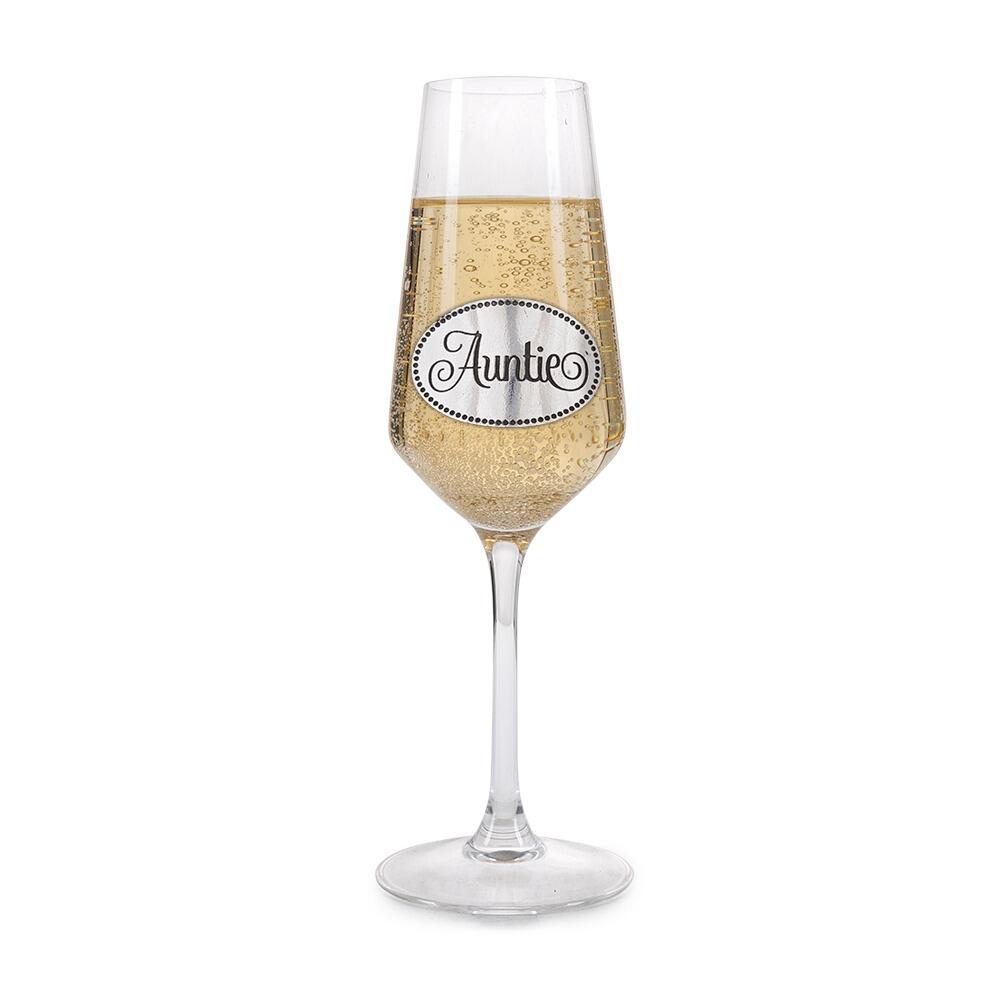 Crystal champagne flute with pewter 'Auntie' badge, filled with bubbly champagne