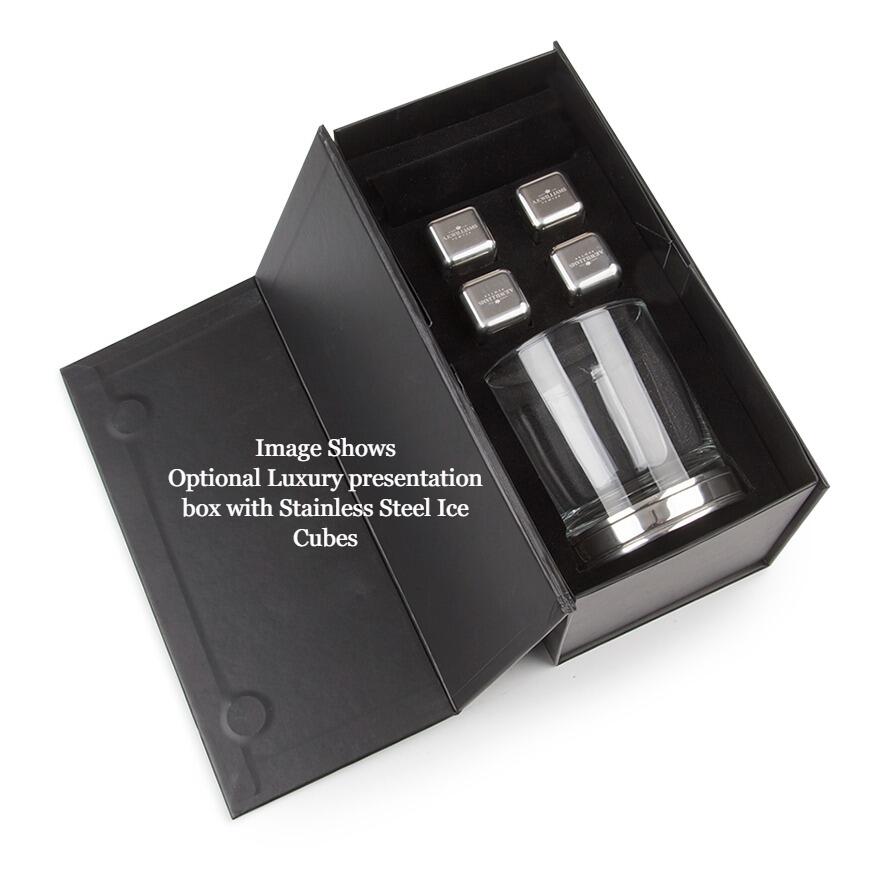 Open black gift box containing a whiskey glass set with tumbler and four metal cooling cubes