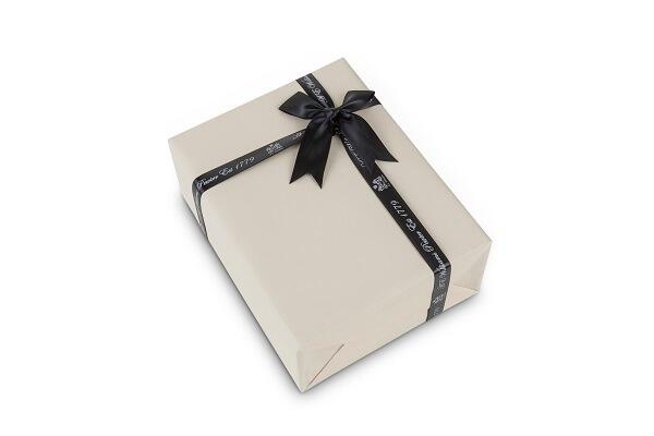 Cream-coloured gift box with black 'A E Williams' ribbon and bow