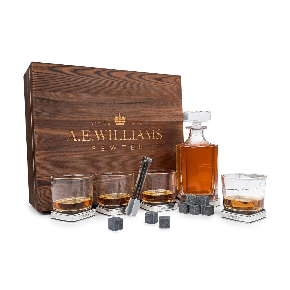 A Decanter Set with 4 Tumblers and a wooden box, shown with a Pewter Base