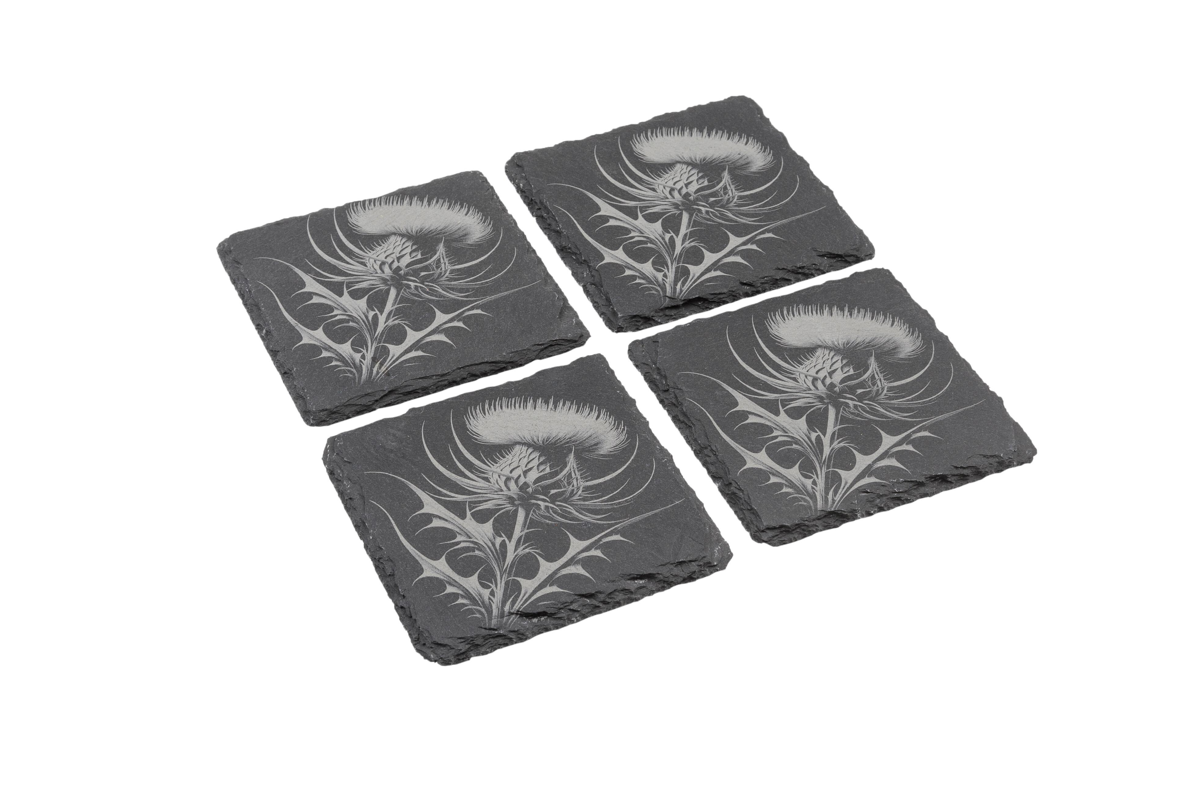 Set of four natural slate coasters with etched Thistle design