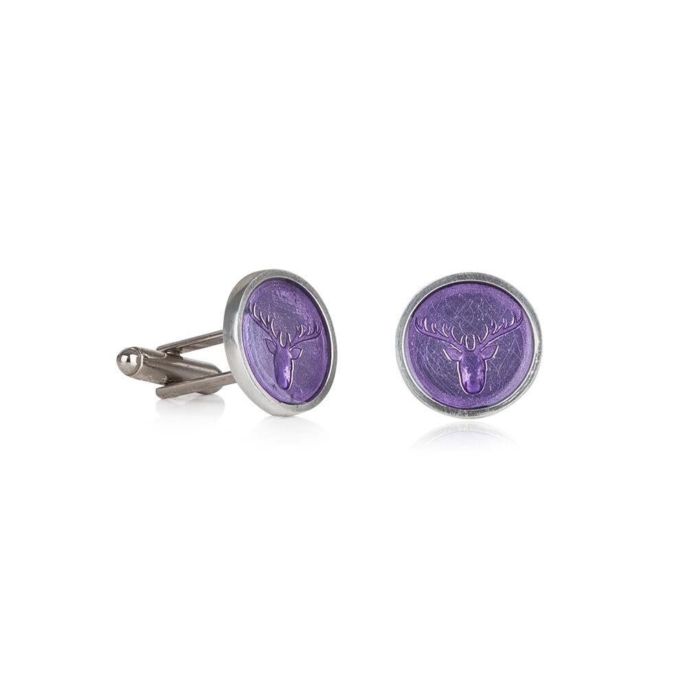 Close-up of handcrafted pewter cufflinks featuring a detailed stag head embossed with transparent lilac enamel