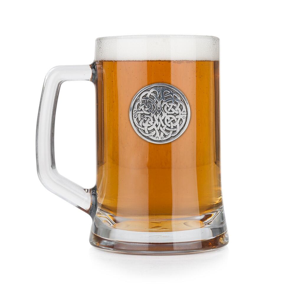 A Beer Tankard with a Pewter Never Ending Knot badge on the front, filled with Amber Beer