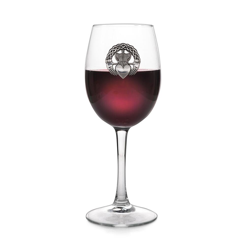 Wine glass with handcrafted pewter Claddagh badge filled with red wine