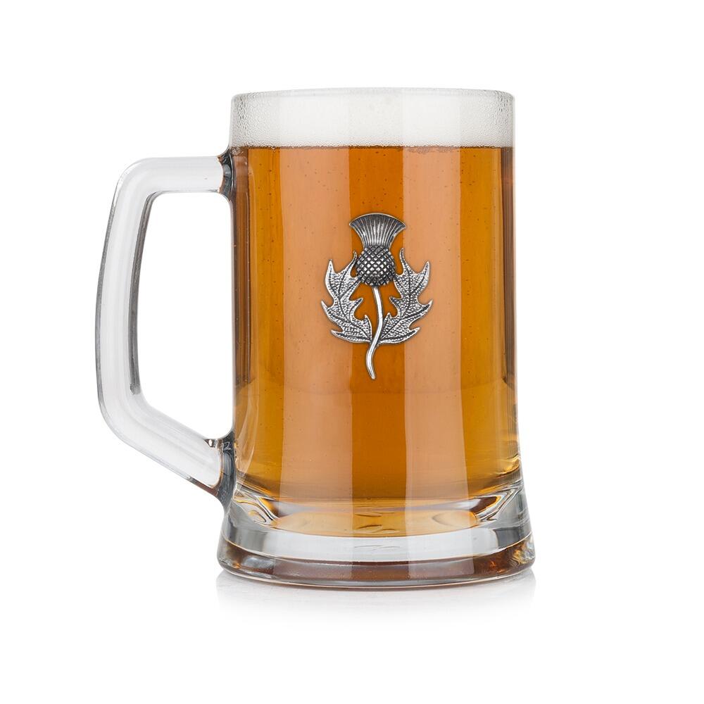 A Beer Tankard with a Pewter Thistle badge on the front, filled with Amber BeerRetryClaude can make mistakes. Please double-check responses.