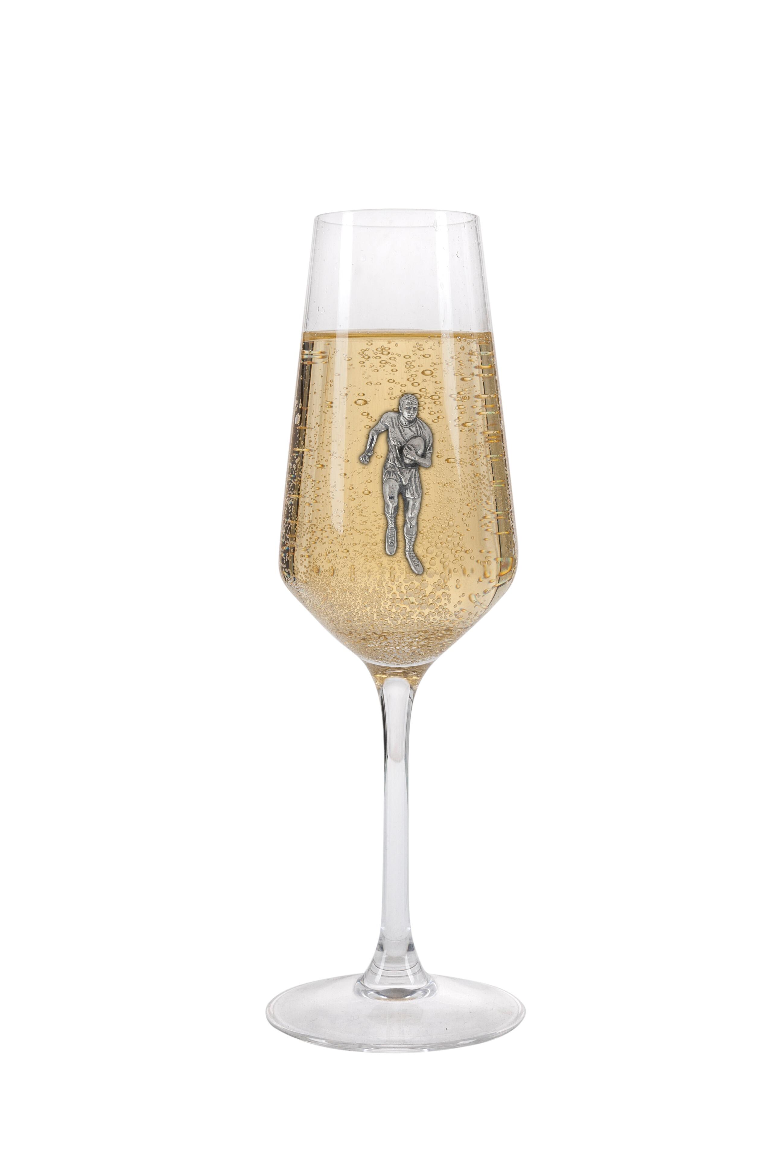 A Champagne Flute with a Pewter Rugby badge on the front, filled with Champagne