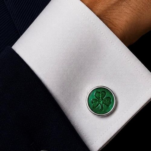 Handcrafted pewter cufflinks with intricate shamrock design embossed in transparent emerald enamel