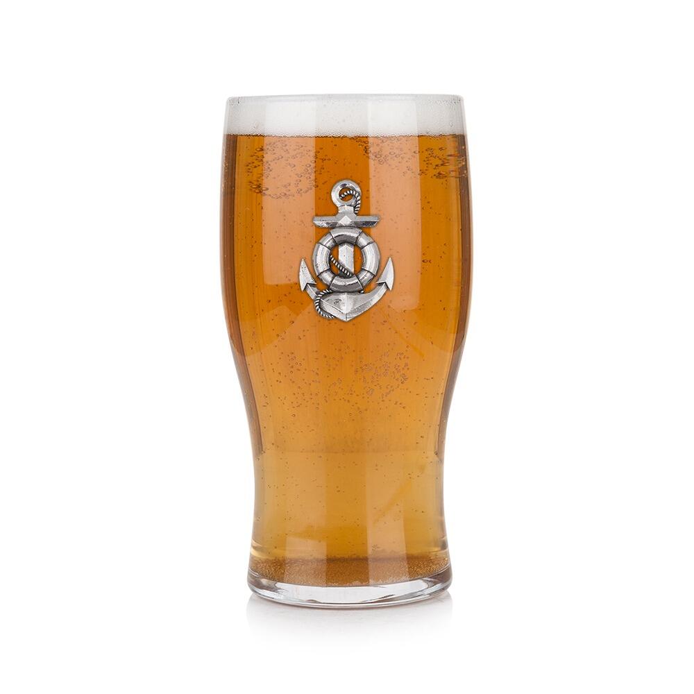 Pint glass with handmade pewter anchor and rope badge filled with golden beer
