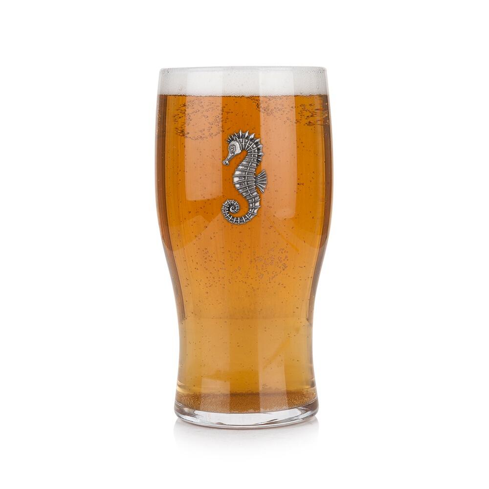 Pint glass with handmade pewter sea horse badge, filled with golden beer