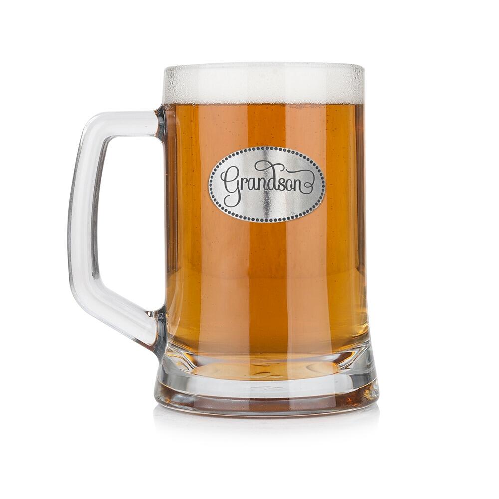 A Beer Tankard with a Pewter Grandson badge on the front, filled with Amber BeerRetryClaude can make mistakes. Please double-check responses.