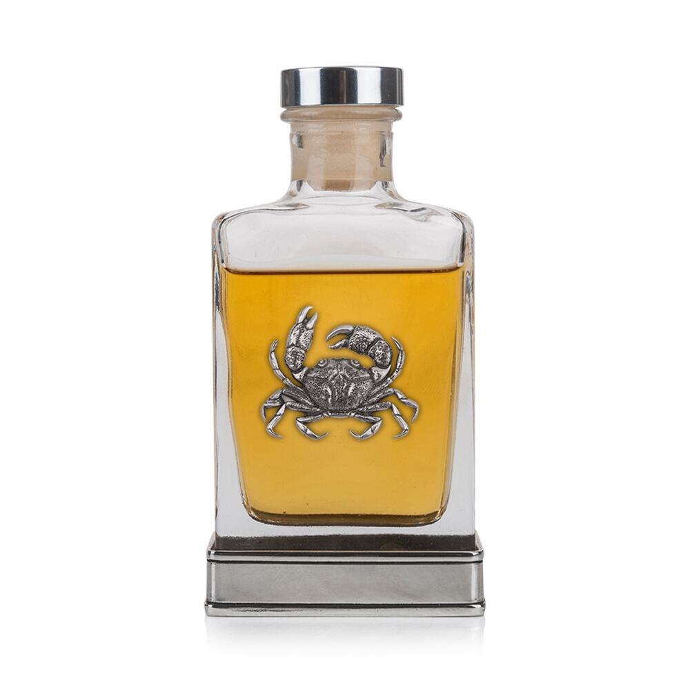 Handcrafted glass hip flask with pewter base featuring detailed crab emblem on front