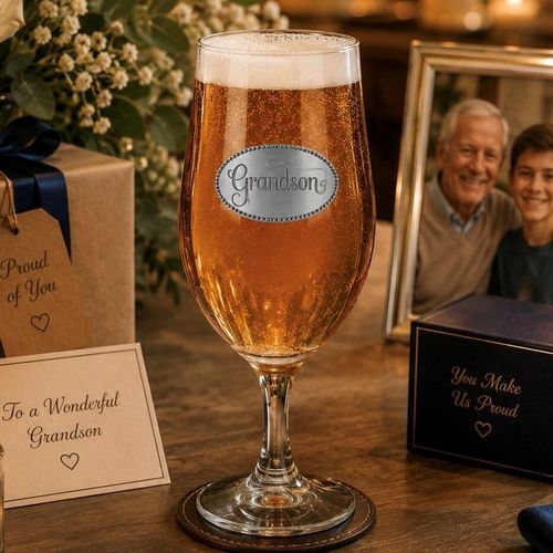 A Stemmed Pint Beer Glass with a Pewter Grandson badge on the front, filled with Beer