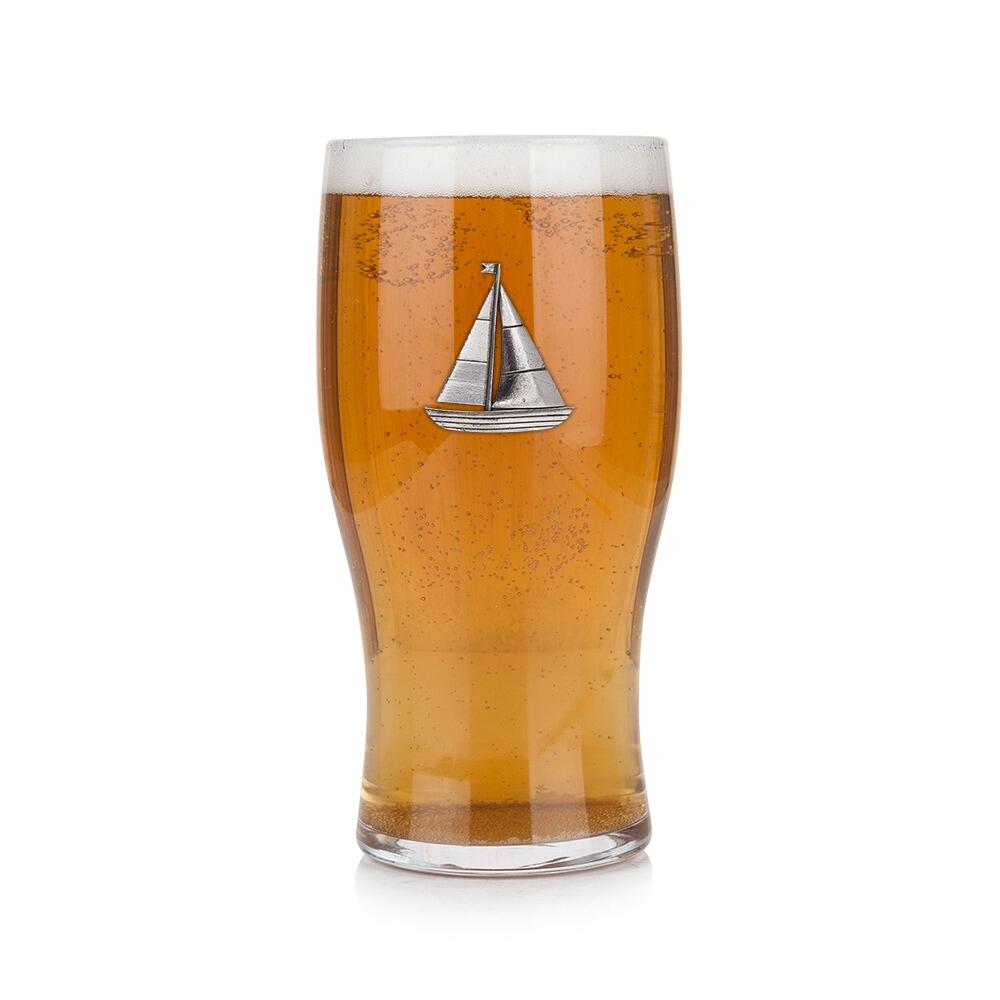 Pint glass with handmade pewter sailing boat with billowing sails and rigging badge filled with golden beerRetryClaude can make mistakes. Please double-check responses.