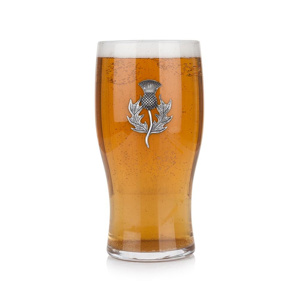 Pint glass with handmade pewter thistle badge, filled with golden beer