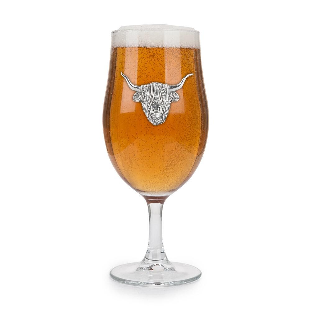 A Stemmed Pint Beer Glass with a Pewter Highland Cow badge on the front, filled with Beer