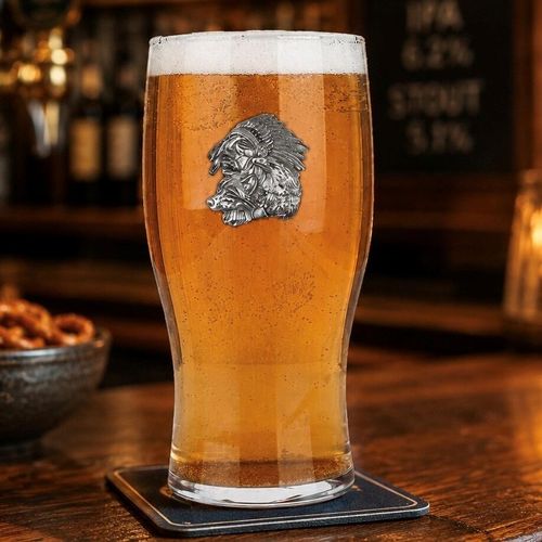 Pint glass with handmade pewter Native American with detailed feathered headdress badge filled with golden beer
