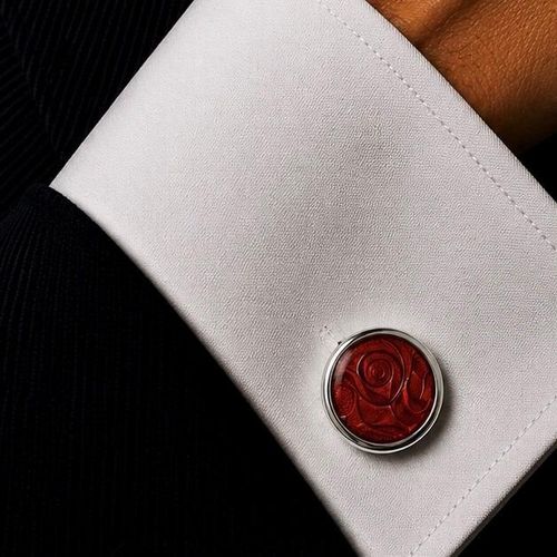 Pair of handmade pewter cufflinks with contemporary red enamelled swirl pattern design