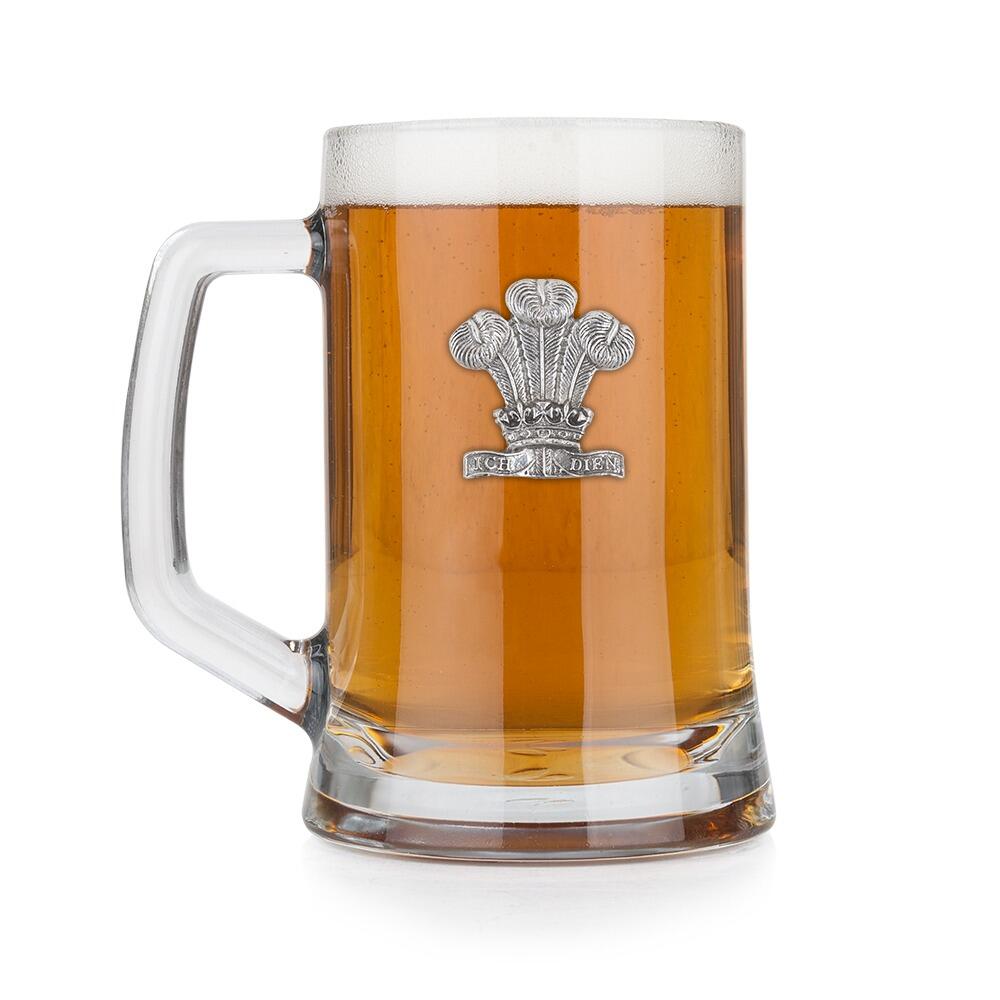 A Beer Tankard with a Pewter Welsh Feathers badge on the front, filled with Amber BeerRetryClaude can make mistakes. Please double-check responses.