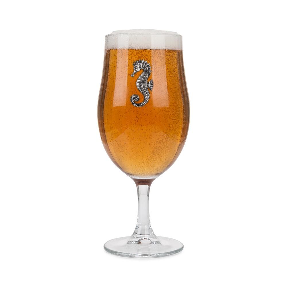 A Stemmed Pint Beer Glass with a Pewter Sea Horse badge on the front, filled with Beer